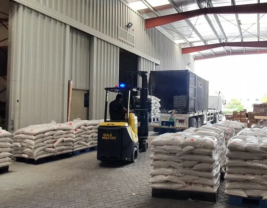 A GGFT delivery vehicle being loaded at the warehouse bay